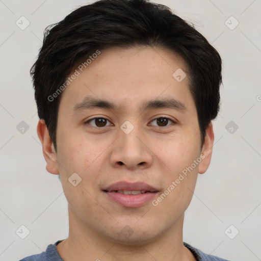 Joyful asian young-adult male with short  brown hair and brown eyes