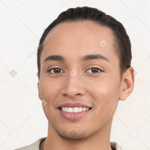 Joyful white young-adult male with short  black hair and brown eyes