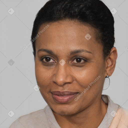 Joyful black adult female with short  black hair and brown eyes