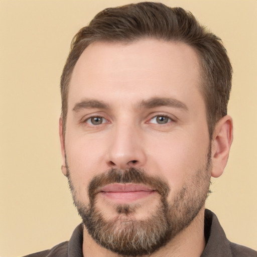 Joyful white young-adult male with short  brown hair and brown eyes