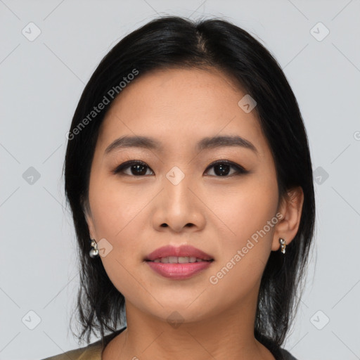 Joyful asian young-adult female with medium  black hair and brown eyes