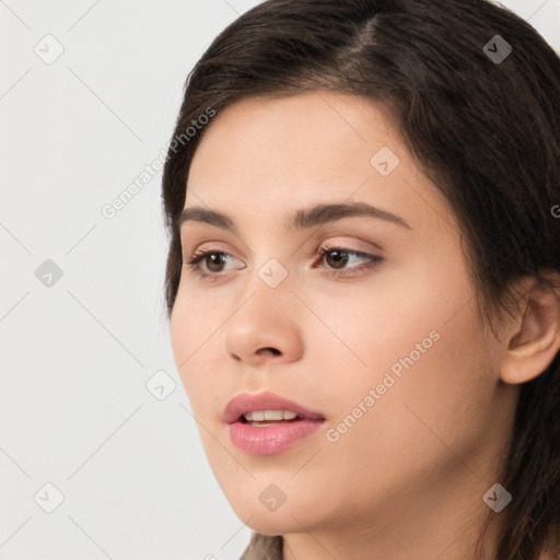 Neutral white young-adult female with long  brown hair and brown eyes