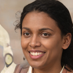 Joyful black young-adult female with long  brown hair and brown eyes