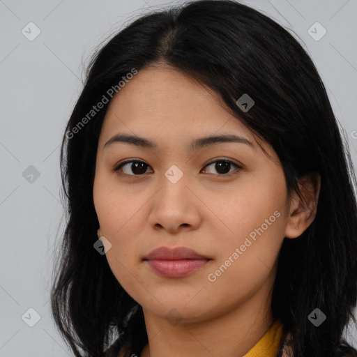 Joyful latino young-adult female with long  brown hair and brown eyes