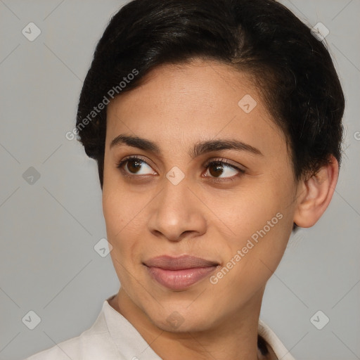 Joyful latino young-adult female with short  brown hair and brown eyes