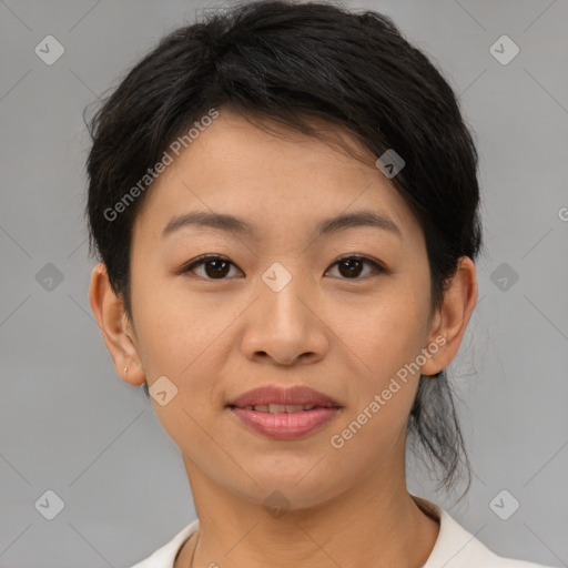 Joyful asian young-adult female with short  brown hair and brown eyes