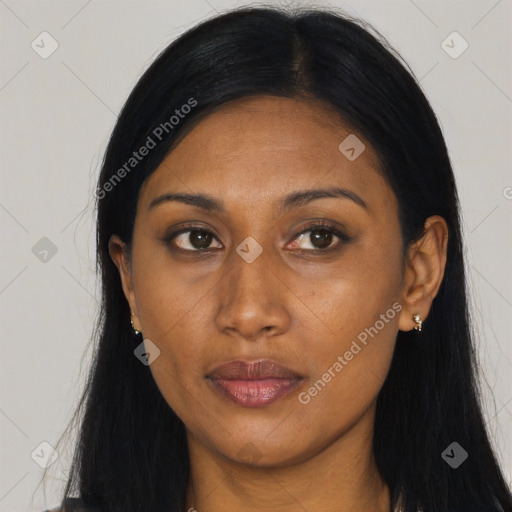Joyful black young-adult female with long  black hair and brown eyes