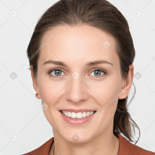 Joyful white young-adult female with long  brown hair and grey eyes