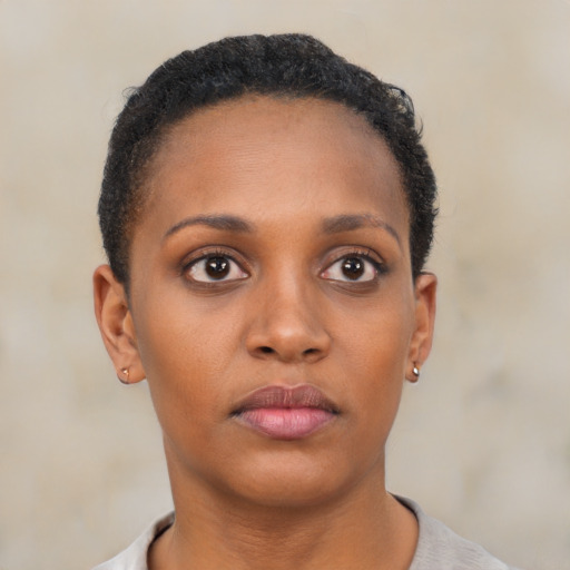 Neutral black young-adult female with short  brown hair and brown eyes