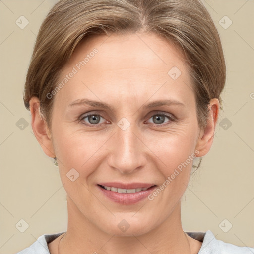 Joyful white adult female with medium  brown hair and grey eyes