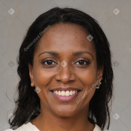 Joyful black young-adult female with medium  brown hair and brown eyes