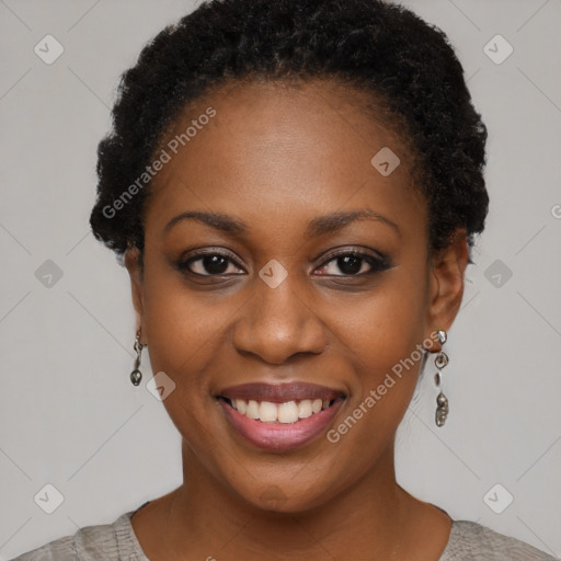 Joyful black young-adult female with short  black hair and brown eyes