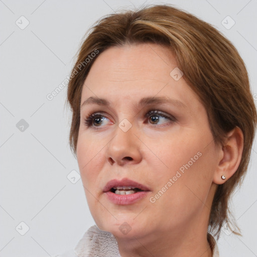 Joyful white adult female with medium  brown hair and brown eyes