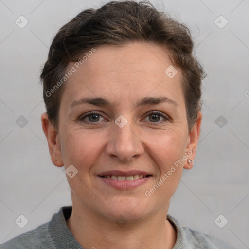 Joyful white adult female with short  brown hair and brown eyes