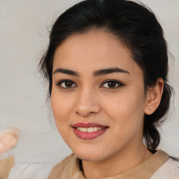 Joyful latino young-adult female with medium  brown hair and brown eyes