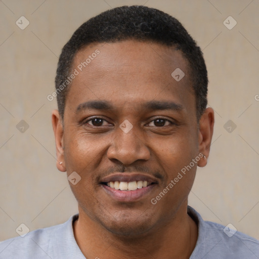 Joyful black young-adult male with short  black hair and brown eyes