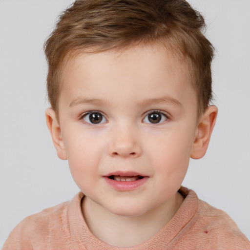 Joyful white child male with short  brown hair and brown eyes