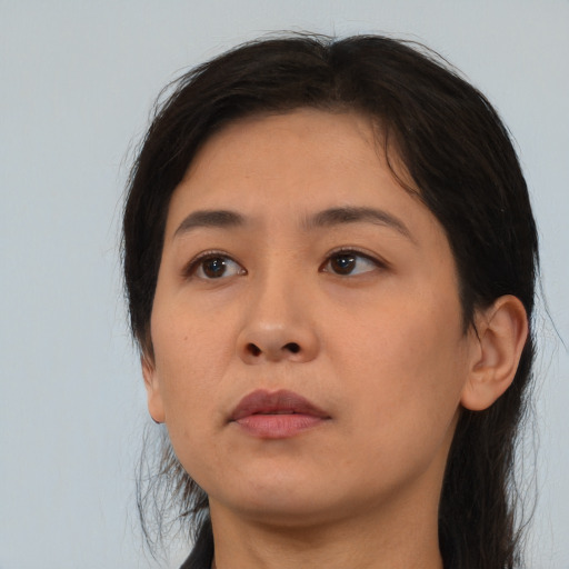 Neutral asian young-adult female with medium  brown hair and brown eyes