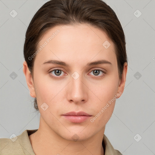 Neutral white young-adult female with short  brown hair and grey eyes