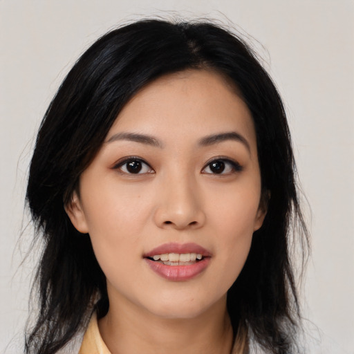 Joyful asian young-adult female with medium  black hair and brown eyes
