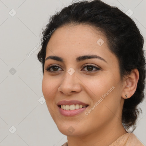 Joyful latino young-adult female with medium  brown hair and brown eyes