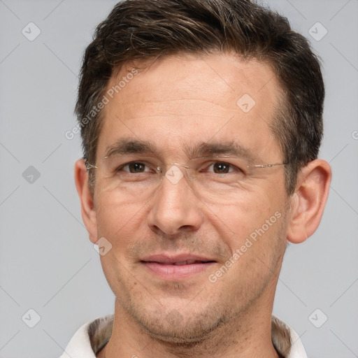 Joyful white adult male with short  brown hair and brown eyes