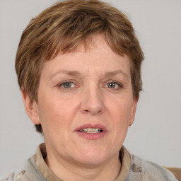 Joyful white adult female with short  brown hair and grey eyes