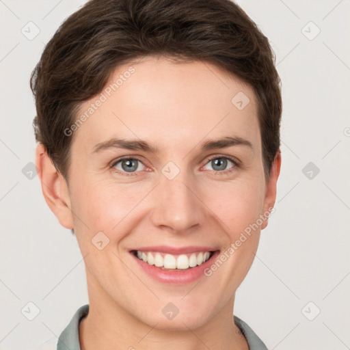 Joyful white young-adult female with short  brown hair and grey eyes