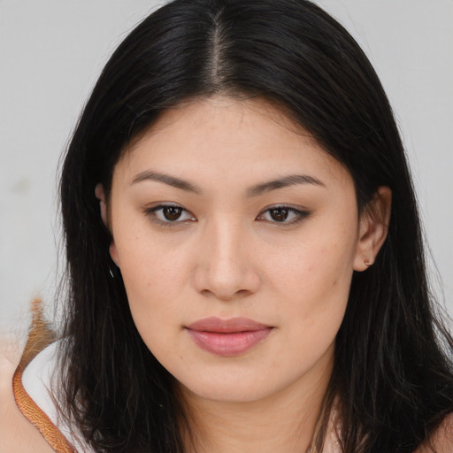 Joyful asian young-adult female with long  brown hair and brown eyes