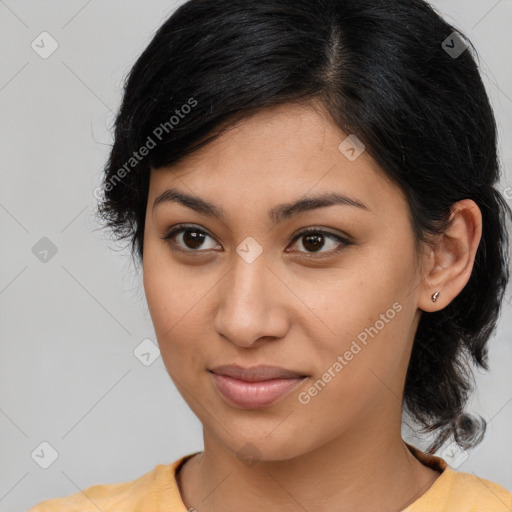 Joyful latino young-adult female with medium  brown hair and brown eyes