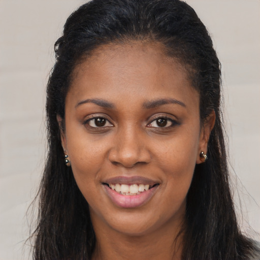 Joyful latino young-adult female with long  brown hair and brown eyes