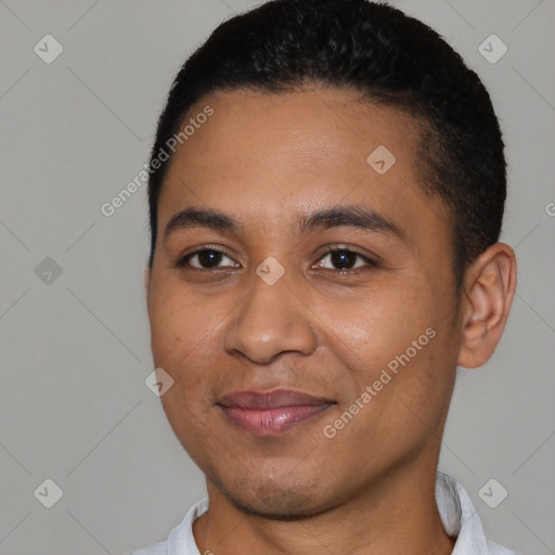 Joyful black young-adult male with short  black hair and brown eyes