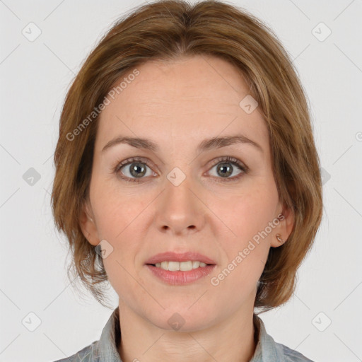 Joyful white adult female with medium  brown hair and grey eyes