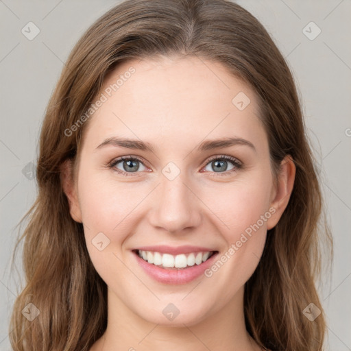 Joyful white young-adult female with medium  brown hair and green eyes