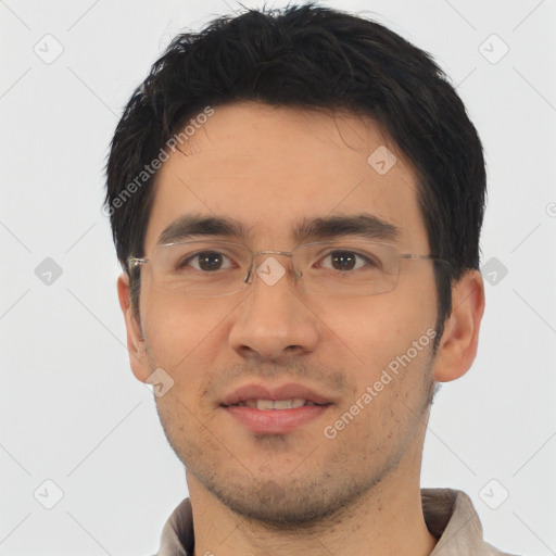 Joyful white young-adult male with short  black hair and brown eyes