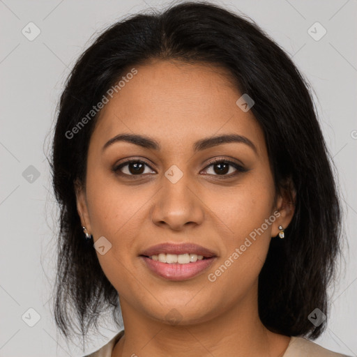 Joyful latino young-adult female with long  brown hair and brown eyes