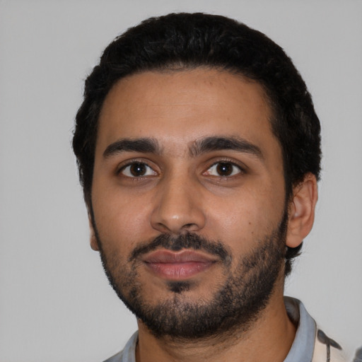 Neutral latino young-adult male with short  black hair and brown eyes
