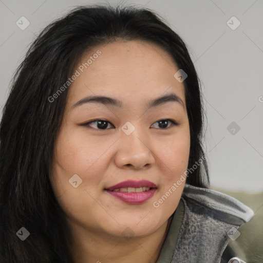 Joyful asian young-adult female with long  brown hair and brown eyes