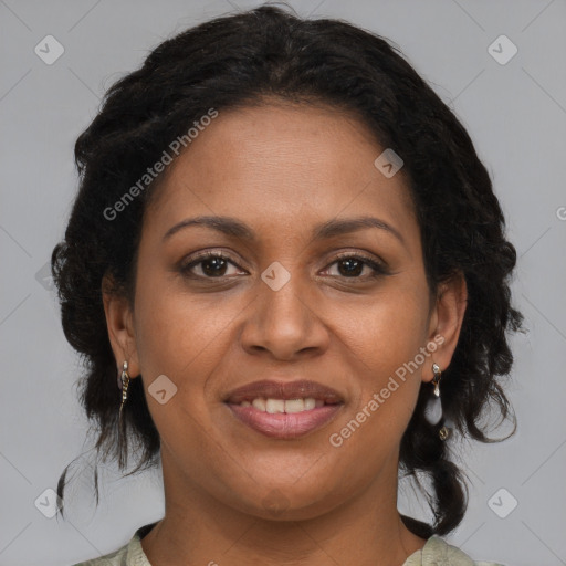 Joyful black adult female with medium  brown hair and brown eyes