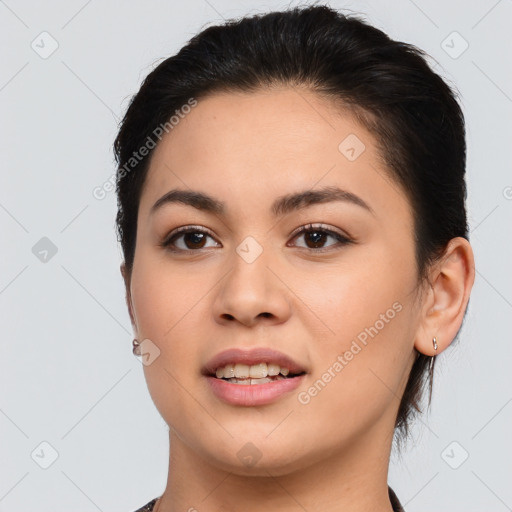 Joyful latino young-adult female with medium  brown hair and brown eyes