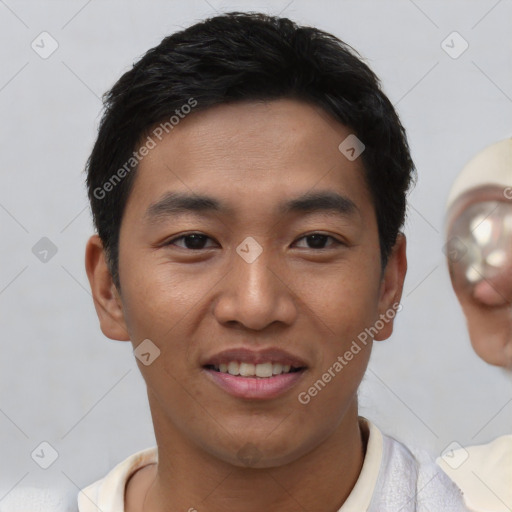 Joyful white young-adult male with short  black hair and brown eyes