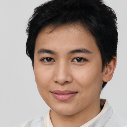 Joyful asian young-adult female with short  brown hair and brown eyes