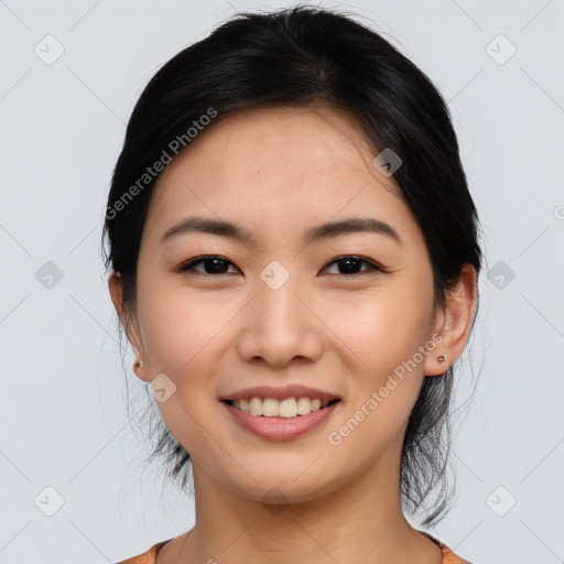 Joyful asian young-adult female with medium  black hair and brown eyes