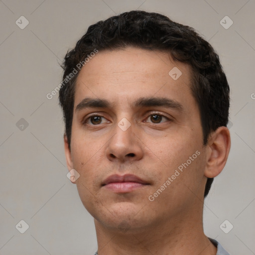 Neutral white young-adult male with short  black hair and brown eyes