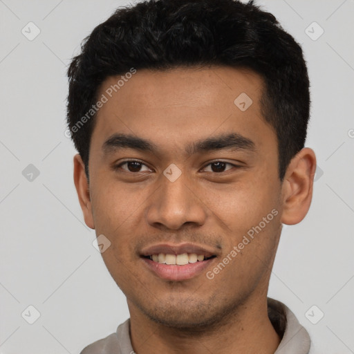 Joyful latino young-adult male with short  black hair and brown eyes