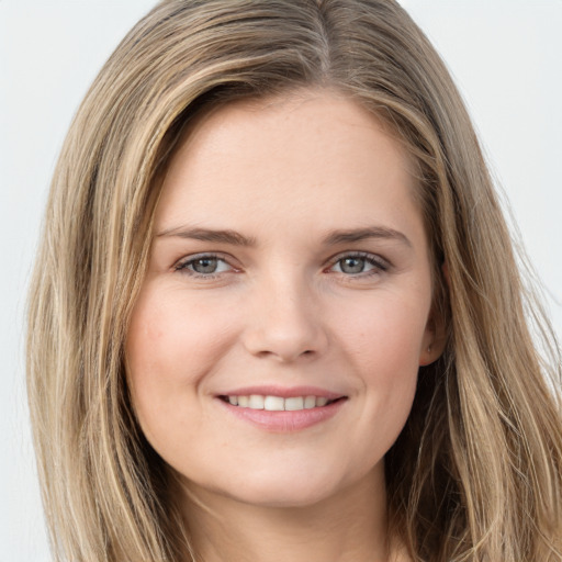 Joyful white young-adult female with long  brown hair and grey eyes