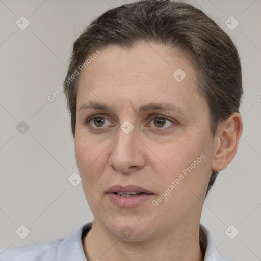 Joyful white adult female with short  brown hair and brown eyes