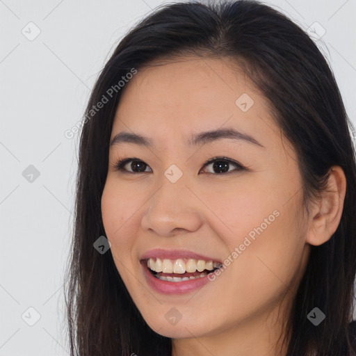 Joyful white young-adult female with long  brown hair and brown eyes