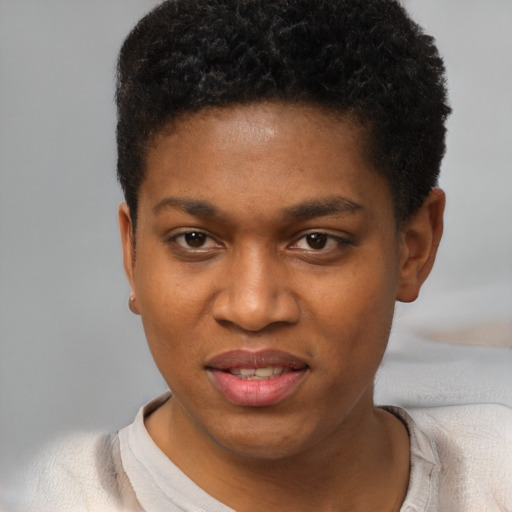 Joyful black young-adult female with short  black hair and brown eyes