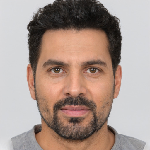 Neutral white adult male with short  black hair and brown eyes